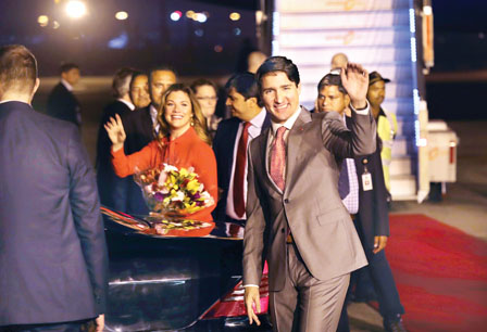 Canadian Prime Minister Justin Trudeau and his wife, Sophie Gregoire Trudeau, wave upon their arrival at the Palam Air Force Station in New Delhi, India, Saturday, Feb. 17, 2018. (AP Photo/Manish Swarup)