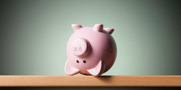 Piggy bank upside down on the shelf.