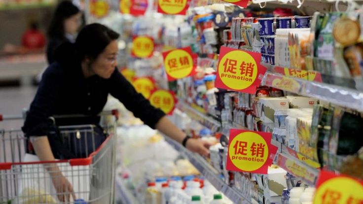 Woman in China shopping for dairy products