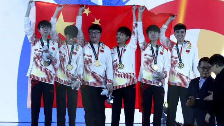 Esports finals winners team China with their gold medals and flag after their win over South Korea in the finals of the League of Legends esports tournament, included as an official demonstration sport in the 18th Asian Games 2018 in Jakarta, Indonesia, 29 August 2018.