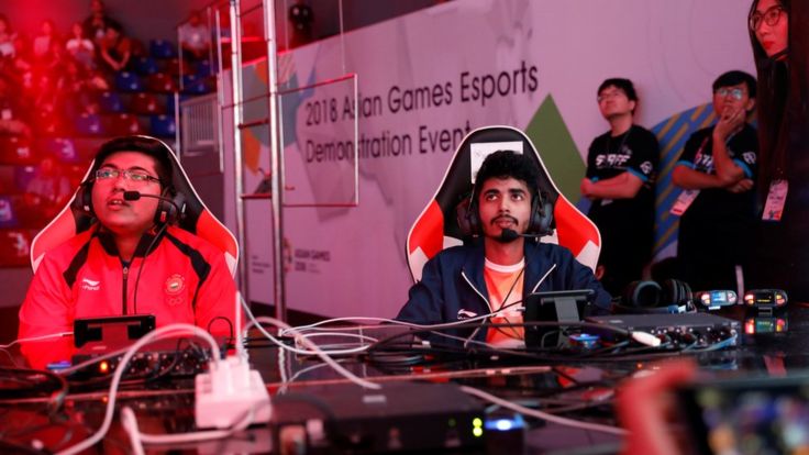 2018 Asian Games - Britama Arena - Jakarta, Indonesia - August 26, 2018 - Players from India react as they watch Arena Of Valor competition.