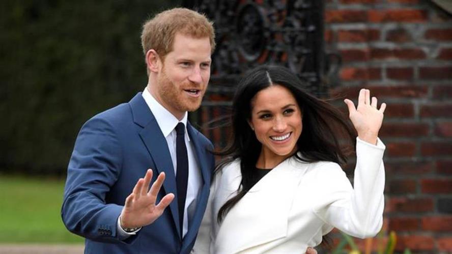 英国哈里王子与妻子梅根。 AP